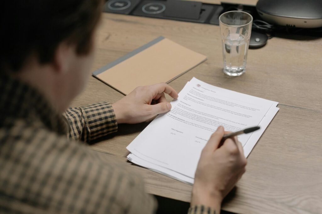 Business owner reviewing a legal notice dubai document with a concerned expression.